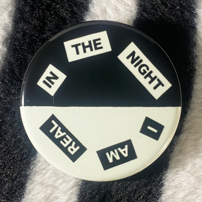 "IN THE NIGHT I AM REAL" glow in the dark pinback button