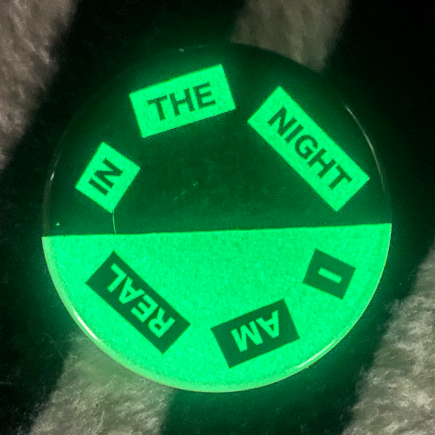 "IN THE NIGHT I AM REAL" glow in the dark pinback button