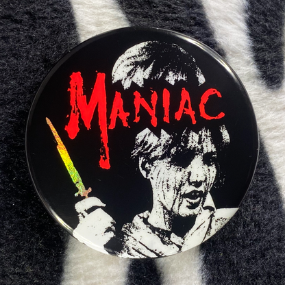 "MANIAC" pinback button