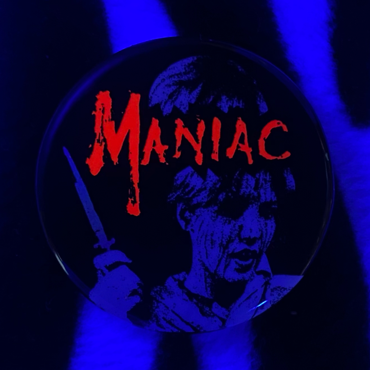 "MANIAC" pinback button