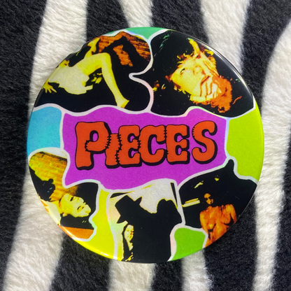 "PIECES" pinback button