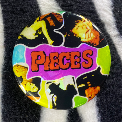 "PIECES" pinback button