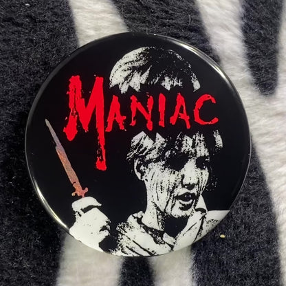 "MANIAC" pinback button