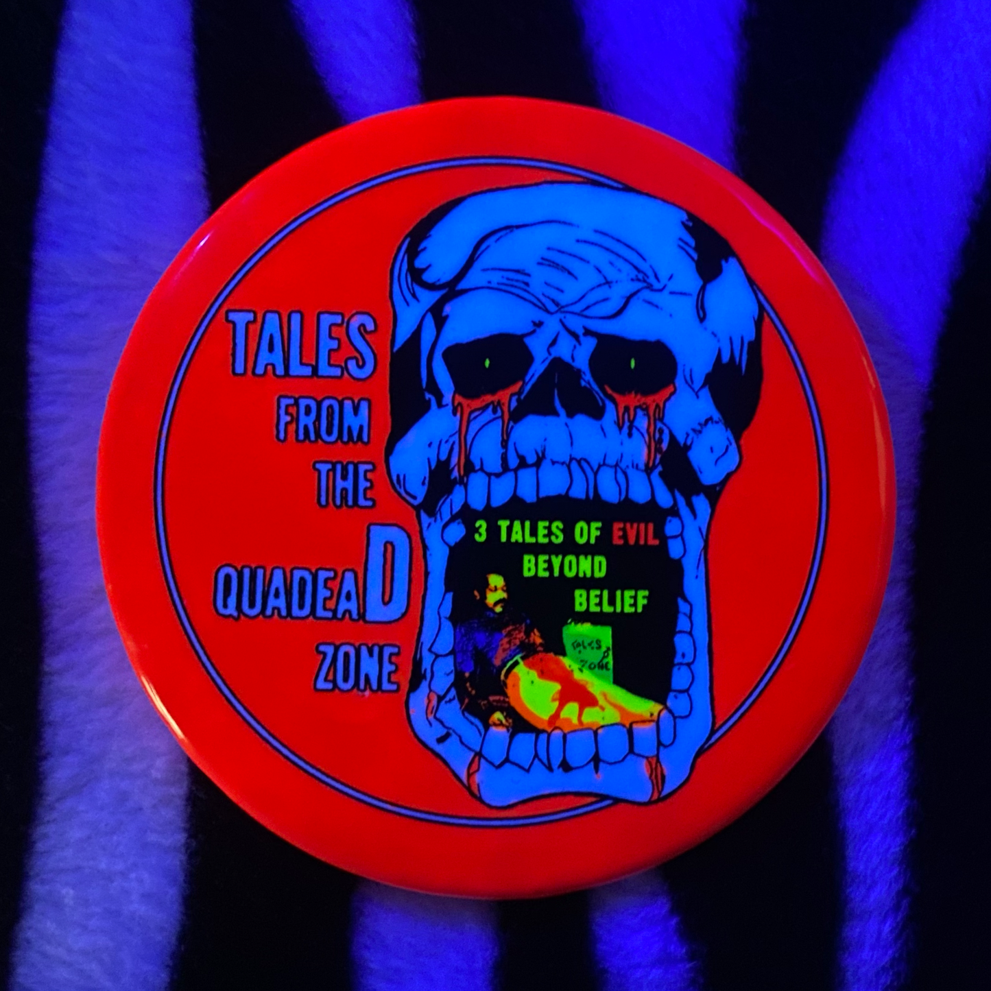 "TALES FROM THE QUADEAD ZONE" blacklight pinback button